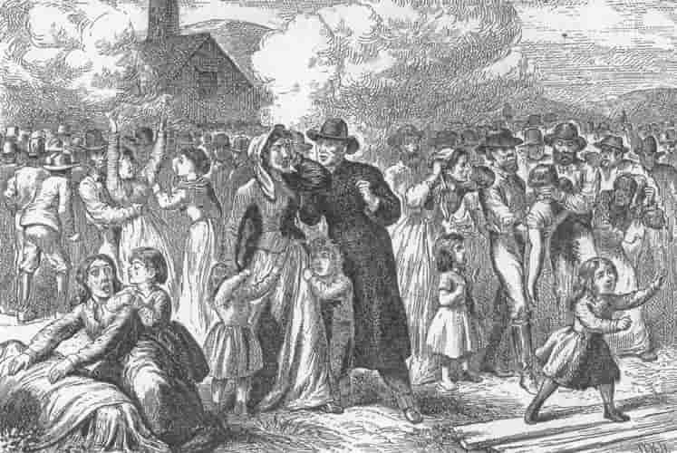 Black and white illustration of women and children mourning the disaster as smoke billows from the mine shaft behind them.